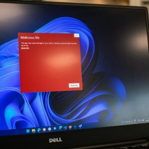a dell laptop computer with a red screen